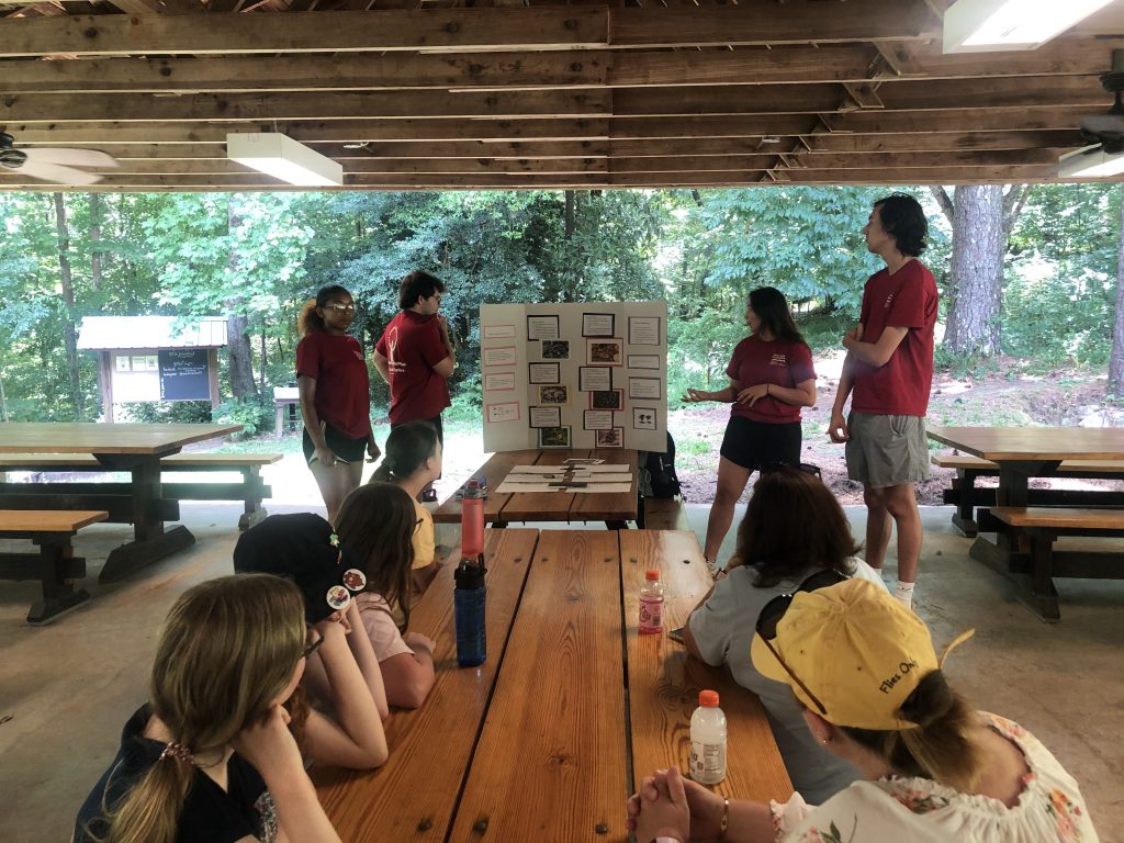 UA students teach about snakes at the Arboretum.